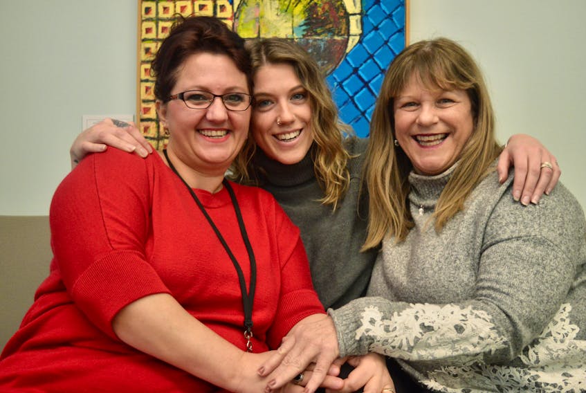 Gjyzela Tetova, left, said she has been overwhelmed by the kindness shown to her family by co-workers like Carly Shields, centre, and Darlene Taylor at SkillsP.E.I. in Charlottetown. Tetova’s hometown of Durres, Albania, was devastated by an earthquake. Although members of her family were not injured, Tetova’s co-workers at SkillsP.E.I. and at the Confederation Centre Public Library immediately sprung into action and organized fundraisers to help raise money for their immediate needs.