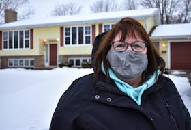 Anne Quinn stands in front of the house on Enman Crescent in Charlottetown she thought she was going to be renting, until she found out she was the victim of a rental scam.