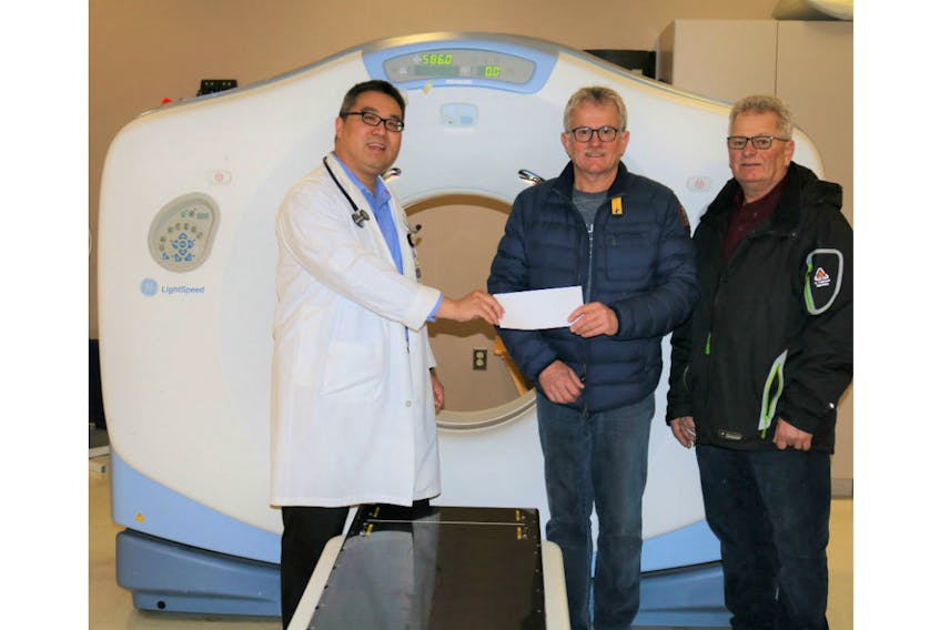 Dr. Larry Pan, left, head of radiation oncology at the P.E.I. Cancer Treatment Centre in the QEH accepts a $5,000 donation from Ross and Errol Burgoyne of Burgoyne Construction to support the QEH Foundation’s Friends for Life campaign. Ross Burgoyne has taken the lead, canvassing others within the construction industry in P.E.I. to contribute toward a new CT Simulator needed for radiation treatment planning. Approximately $75,000 has been raised by companies representing the many different trades within the industry.