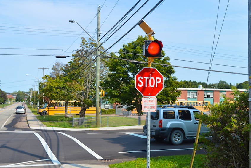The City of Charlottetown has installed solar-powered flashing red lights on the top of each stop sign at the intersection of Pine Drive and Maple Avenue in an effort to improve safety.