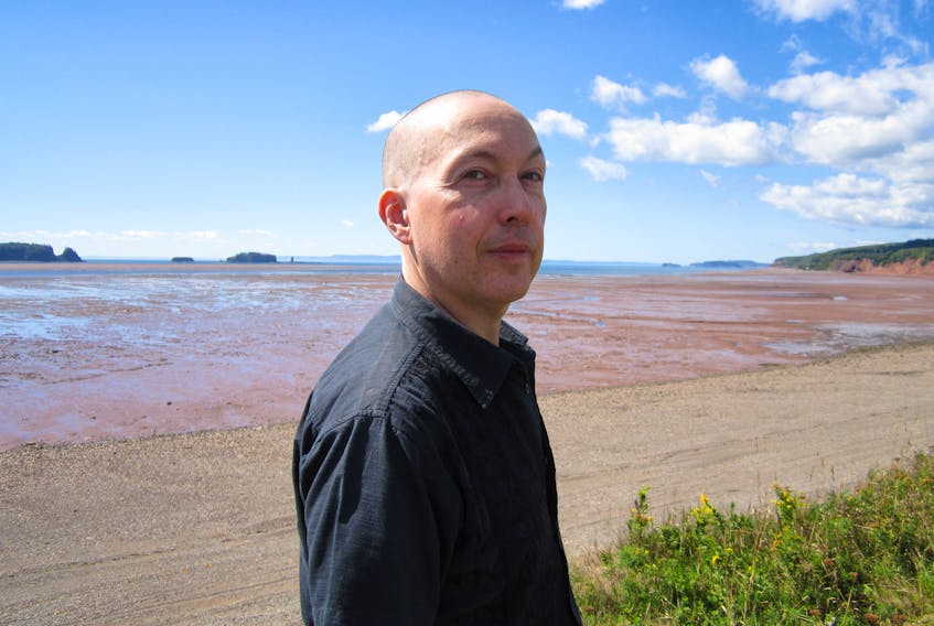 Canadian author Jeff Bursey, pictured here along the Bay of Fundy in this undated photo, has just released his latest book, Unidentified man at left of photo, about his observations while living in Charlottetown from 2000-18. Beth E. Janzen/Special to The Guardian