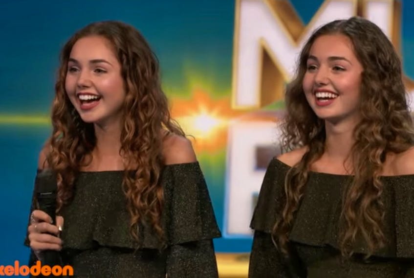 Ava and Lily Rashed, the 16-year-old daughters of David and Sue Rashed of Charlottetown, listen to the judges critique their performance Friday night on the U.S. reality show “America’s Most Musical Family’’. They advanced to the semifinals. - Screenshot