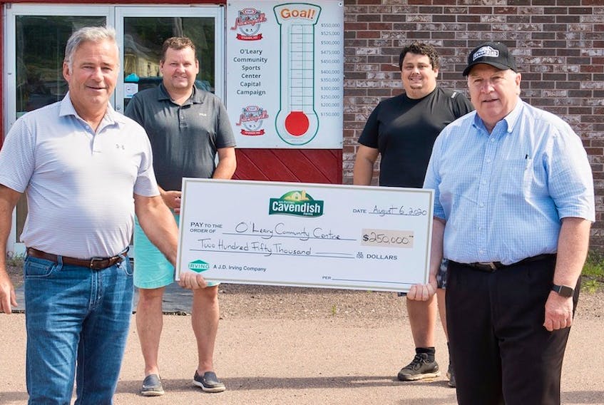 Cavendish Farms president Robert K. Irving, front right, presents a cheque for $250,000 to O’Leary Community Sports Centre board member David Harris. The money will go towards the facility’s major restoration initiative. Also taking part in the presentation are board members, from left, Dean Getson and Andrew Avery. Also taking part in the presentation were board members Kyle Cooke, Darren Hutchinson and Nick Reilly along with Wayne MacDonald, senior vice-president, corporate relations, J.D. Irving. Ellagant Photography/Special to The Guardian