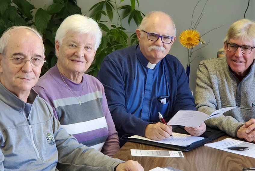 Executive secretary Donald Gaudet, left, executive member Sister Teresa Currie, organizing chairman Rev. G. Wayne Short and CACC president Tom Garland are preparing for the 26th annual Prayer Breakfast to be held on Jan. 18.