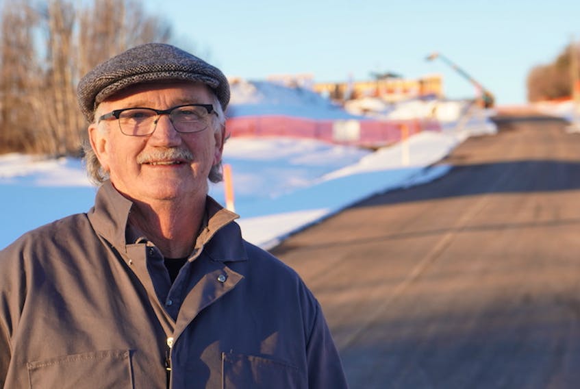 Ronnie McInnis, mayor of St. Peters Bay, stands outside the facility on Jan. 11 that is being constructed in the community by the University of Prince Edward Island.