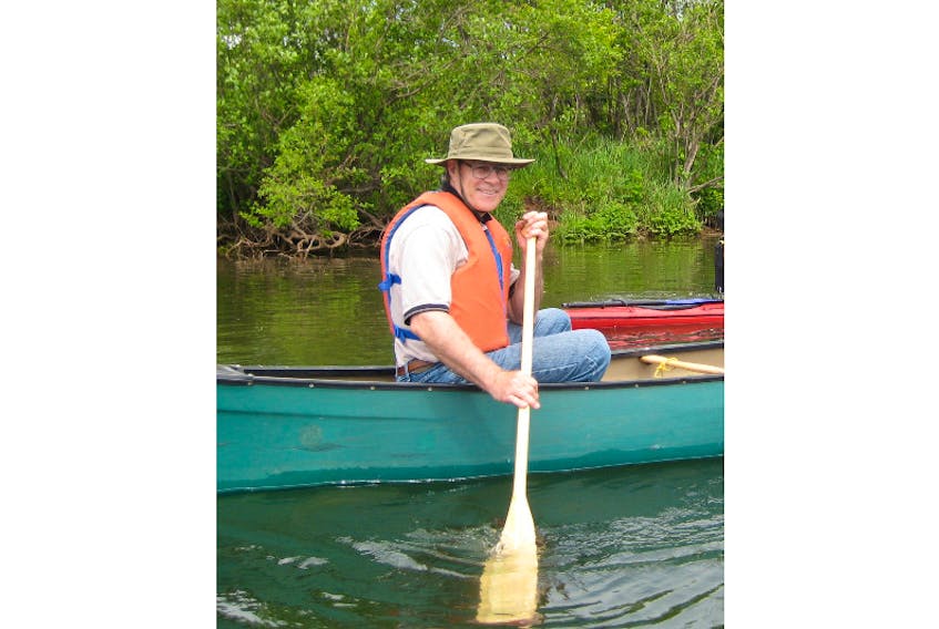 Diane Griffin shot this photo of Daryl Guignion in a canoe during his June 2008 retirement celebration on the West River.