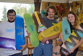 Three Charlottetown entrepreneurs have launched P.E.I.’s first skateboard manufacturing business. From left are Jeffrey Lockert, Jamie Crawford and Emily Cornish.