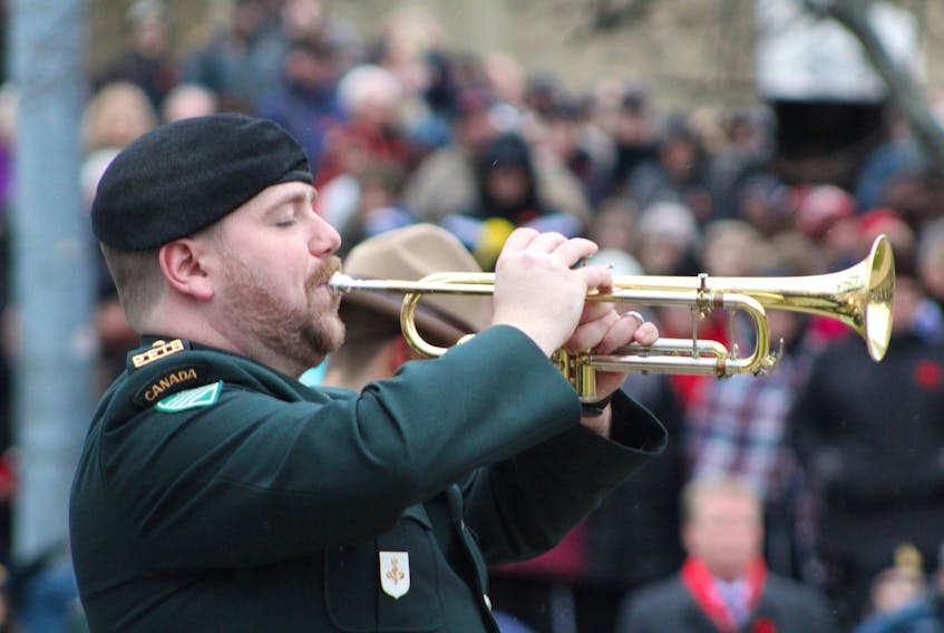 A member of the Prince Edward Island Regiment Band plays his horn during Remembrance Day at the Charlottetown Cenotaph on Tuesday, Nov. 11. Daniel Brown/The Guardian