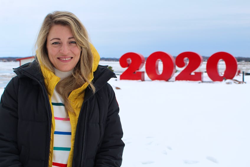 Liberal MP Mélanie Joly checks out the iconic red numbers at the waterfront end of Queen St. in Charlottetown on Jan. 11.