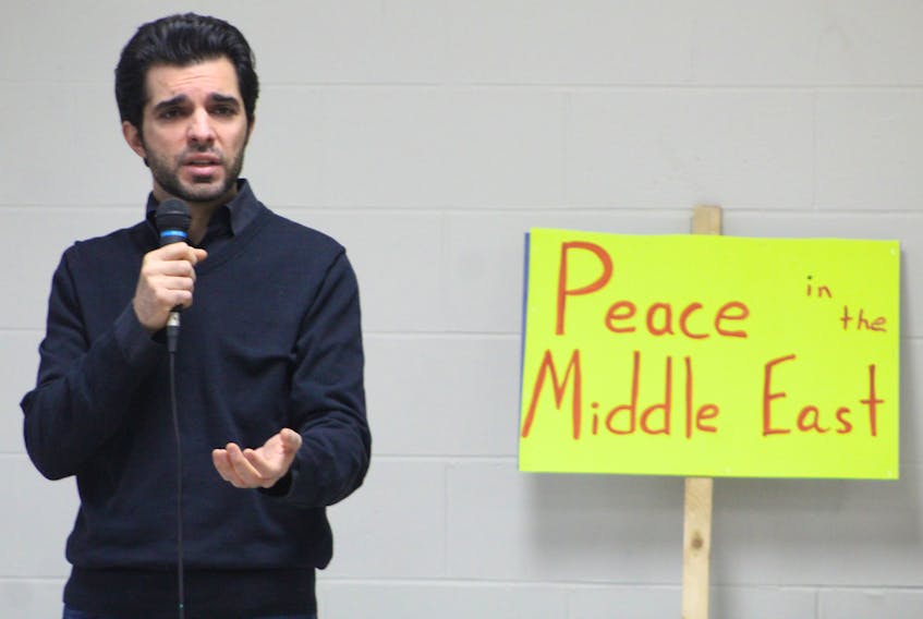 Ali Siadat delivers an emotional anti-war speech during a peace rally at Murphy's Community Centre in Charlottetown on Jan. 11. About 60 people attended the rally, which was organized to oppose recent acts of aggression by the U.S. against Iran. 
"The last few days was just a nightmare for everyone. Especially Iranian Canadians," Siadat said. A petition calling Canada to oppose a potential war against Iran was passed around, and will be sent to the Prime Minister's office.