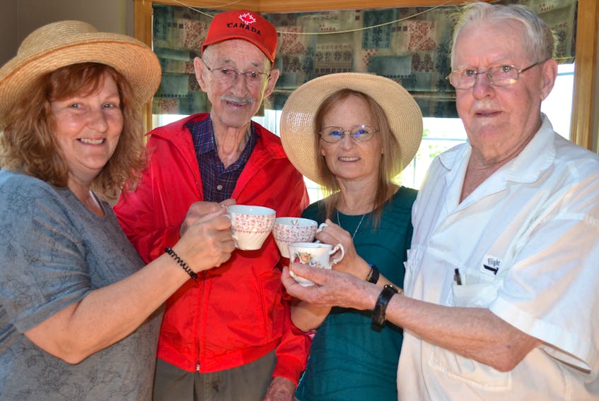 Organizers of the Kelly’s Cross Tea Party/Picnic discuss plans for the Saturday, July 13, event over a cup of tea. From left are Jackie Molyneaux, Gavin Toole, Raeona Lacey and Joe Matters.