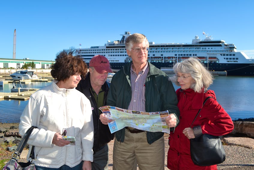 Cruise ship passengers aboard the MS Veendam study a map of Charlottetown before setting out on foot to tour the city on Wednesday. During their stop on P.E.I., they also took a north shore tour, which included visiting Green Gables Place in Cavendish. From left are Louise and David Hull, Queensbury, N.Y., and Rene and Pam Jacques from Sunderland, Mass.