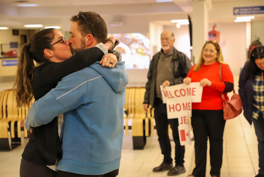 Maj. Jennifer Arsenault is greeted by her husband Christopher Michaud, also an officer with the Canadian Armed forces, along with colleagues, friends and family at the Charlottetown Airport on Wednesday, Nov. 6. Submitted