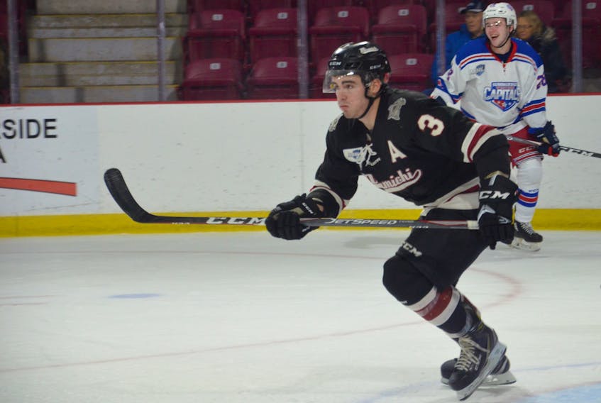 Defenceman Jack DesRoches in action with the Miramichi Timberwolves during a Maritime Junior Hockey League game against the Summerside Western Capitals at Eastlink Arena recently. Caps forward Josh MacDonald is in the background.