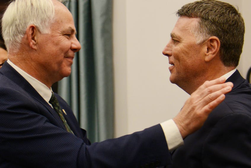 Opposition Leader Peter Bevan-Baker and Premier Dennis King share a hug during the spring sitting of the P.E.I. legislature.