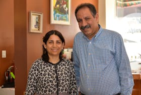Seyedazim Sharif and his wife Zeynab inside Linda's Coffee Shop and Restaurant on Thursday.