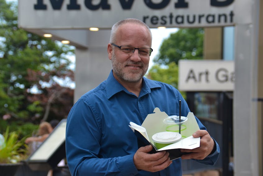 Rob Warren displays the compostable materials being used by Mavor’s Restaurant in Charlottetown. Warren is the food and beverage manager at the Confederation Centre of the Arts.