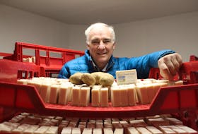 Pieter Ijsselstein surrounds himself with the star product of his company, Island Potato Soap Company. One of the main ingredients of his product is P.E.I. potato juice. Daniel Brown/The Guardian.
