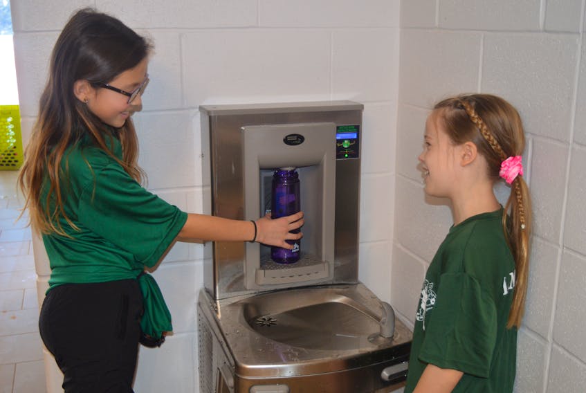 Grade 5 students Dana Warren, left, 10, and Laila Ellis, 10, say new refillable water stations like this one are among the best features of the $5.3-million addition to L.M. Montgomery Elementary School in Charlottetown’s East Royalty neighbourhood.