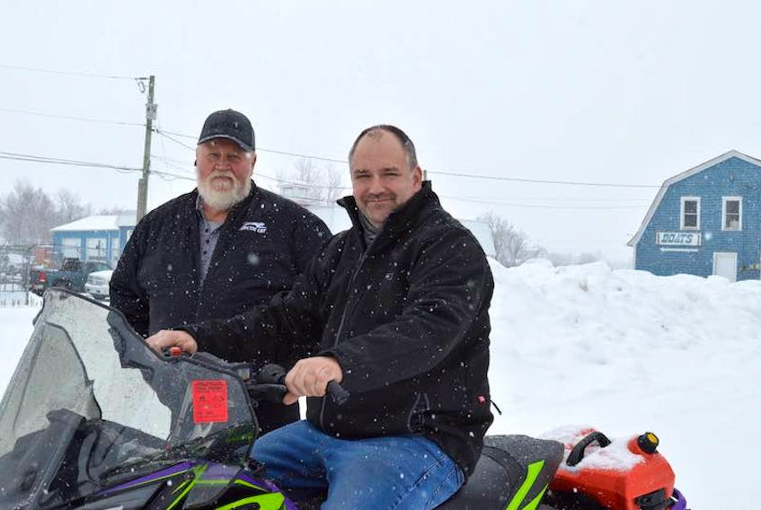 P.E.I. Snowmobile Association president Dale Hickox, left, and vice-president Grant Peters pose for a photo near the Confederation Trail in Winsloe. The group is concerned at the number of near-misses involving walkers and dogs on the Confederation Trail and reminds Islanders that while there is snow on the trails a lease agreement with the province says snowmobiles have the right of way.