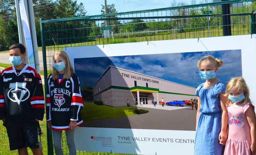 Tyne Valley minor hockey players, from left, Reece Grigg and Drew Kelly joined Tyne Valley figure skaters Sarah Enman and Emily Enman at an event Monday morning unveiling plans for a new Tyne Valley Events Centre.