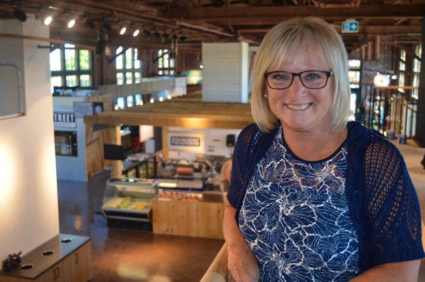 Joanne MacMillan, customer relations and tenant services manager for Port Charlottetown, leads a media tour through the Founders’ Food Hall and Market in Charlottetown, which officially opens to the public on Friday.