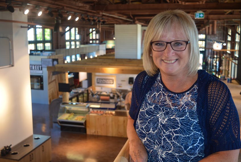 Joanne MacMillan, customer relations and tenant services manager for Port Charlottetown, leads a media tour through the Founders’ Food Hall and Market in Charlottetown, which officially opens to the public on Friday.