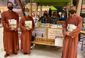 Buddhist monks and volunteers are shown recently at the Confederation Court Mall in Charlottetown.