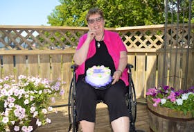 Marlene Bryenton holds a cake celebrating her next book, Jaya’s Magic Wheelchair, which is about her 11-year-old granddaughter. The Charlottetown resident, who is hoping to release the book on her 70th birthday in September, is currently recovering from hip surgery.