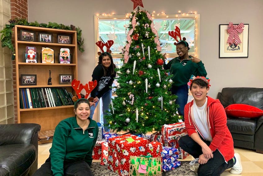 Many Christmas gifts are ready to be delivered to students through the UPEI Student Union’s wishing tree program. From left are student union officials Malak Nassar, Anagha Muralidharan, Ayomikun Oguntola and Jose Alejandro Gonzalez.