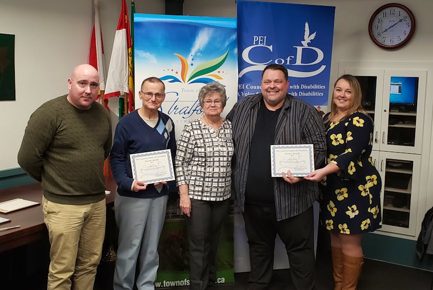Collège de l’Île received an Access Award from the P.E.I. Council of People with Disabilities’ (PEICOD) at its annual recognition evening. The award was given for creating an inclusive learning environment for students with barriers. From left are Darryl Gauthier, PEICOD staff member, Robert Bullen, Collège de l’Île, Anne Christopher, PEICOD board member, Maurice Hashie, Collège de l’Île and Devon Broome, PEICOD staff member.