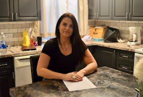 Ellen Taylor sits in her kitchen in Charlottetown with a copy of a letter she sent to Health Minister James Aylward that raised concerns about addiction treatment options in P.E.I.