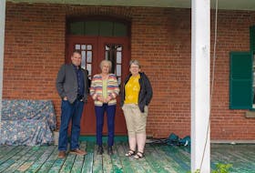 Justice Minister Bloyce Thompson, left, with Aggi-Rose Reddin and Mary Gallant, vice-chair and chair of board for the Glenaladale Trust, are shown on the porch of the Glenaladale house in June 2019.