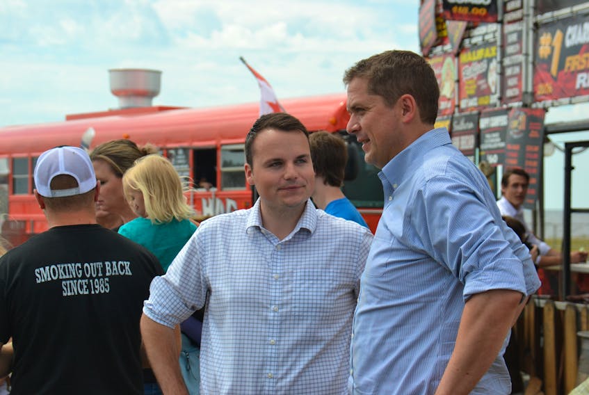 Federal Conservative Leader Andrew Scheer, right, speaks with Egmont Conservative candidate Logan McLellan during Scheer's stop in Summerside earlier this summer. A new poll by Narrative Research indicates the federal Conservatives are the preferred party among decided voters on P.E.I. Stu Neatby/The Guardian