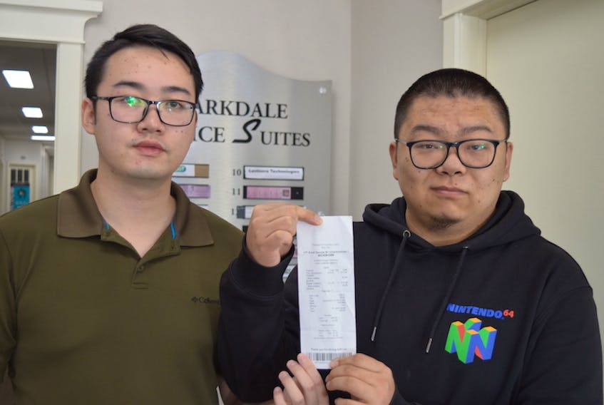 Mark Ma, left, and Blake Zhang were upset that they were identified as “Asian guys’’ on their receipt from Crafters Burger Company in Charlottetown. The manager has apologized to the men and has vowed to remove any references on the receipts that might be considered offensive.