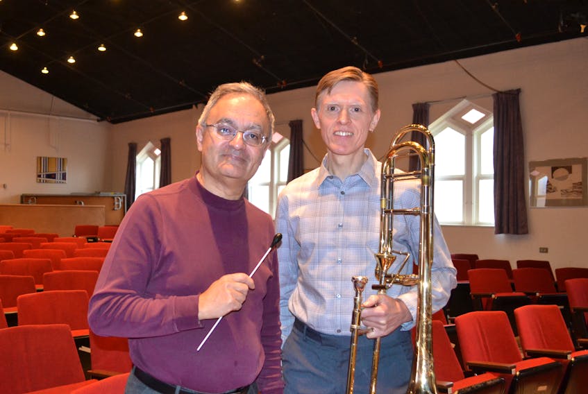Karem Simon, left, and Dale Sorensen discuss the upcoming UPEI Wind Symphony concert. Simon is directing and Sorensen is the soloist at the Nov. 21 performance, to be held in the Homburg Theatre of the Confederation Centre of the Arts.