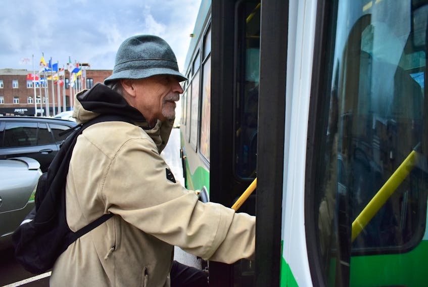 Bob Foster catches a T3 Transit bus home on Friday, Nov. 15. He rides every day into Charlottetown to read at library and meet friends. Michael Robar/The Guardian