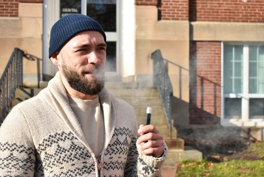 John Thompson, 25, of Charlottetown takes a break from class outside Holland College on Friday.