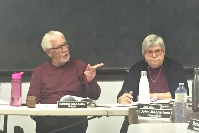 Three Rivers Mayor Edward MacAulay and deputy mayor Debbie Johnston deliberate at a town council meeting at the Lower Montague Community Hall.
