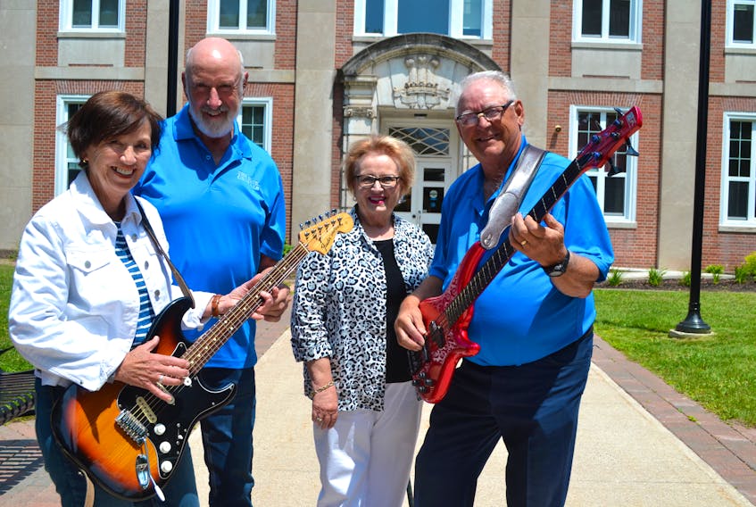 Prince of Wales College Alumni Dianne Anderson, left, and Barb MacNutt are ready to celebrate two landmark anniversaries during the Prince of Wales College Reunion in Charlottetown on Friday, July 26, with the help of the Blue Crystals. From left are Leonard McEwen, lead guitar/vocals, and Ian Hunter, bass and vocals. Missing from the photo are Blue Crystal members Ronnie MacLean, drums, Dave Altass, vocals, and Bob Perry, rhythm guitar. Submitted