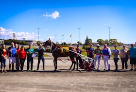 Bettim Again in the winner's circle at Red Shores at the Charlottetown Driving Park after claiming his P.E.I. Colt Stakes division in a Maritime and track record for two-year-old pacing colts of 1:54.1. Stephanie Mitchell/Red Shores