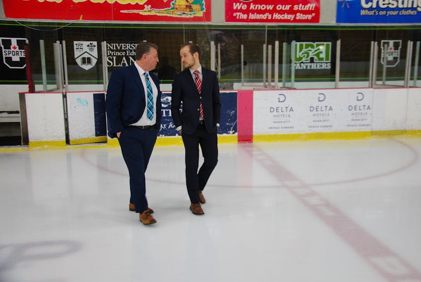 Premier Dennis King, left, and Guardian reporter Stu Neatby walk across the ice at MacLauchlan Arena at the Bell Aliant Centre after completing the second of three segmens of a year-end interview. JIM DAY/THE GUARDIAN