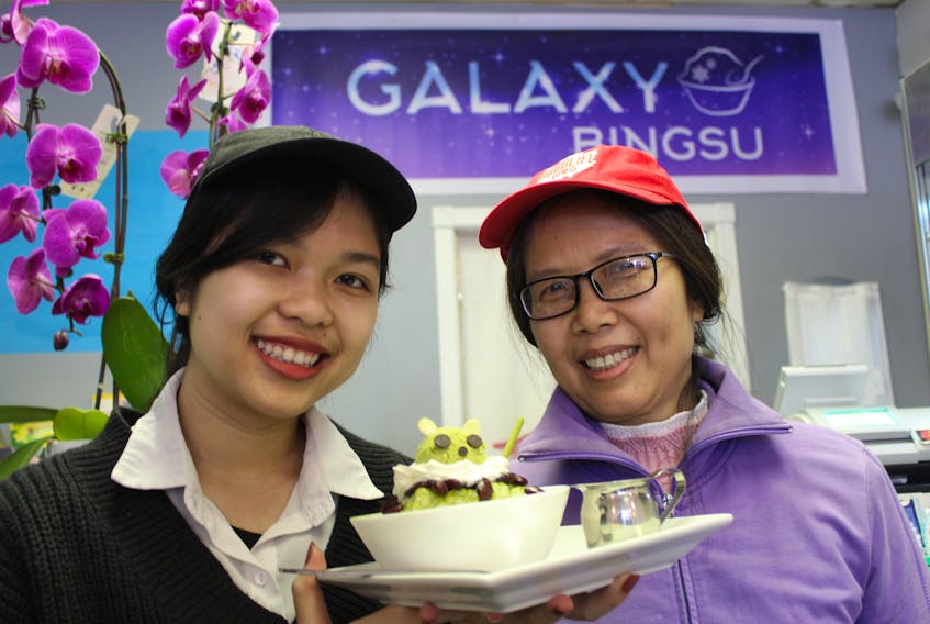 Lena Nguyen, left, and her mother, Lan, show off one of their top bingsu flavours at Lan's new shop, Galaxy Café & Bingsu, in Charlottetown during its grand opening on Jan. 18. - Daniel Brown/The Guardian.