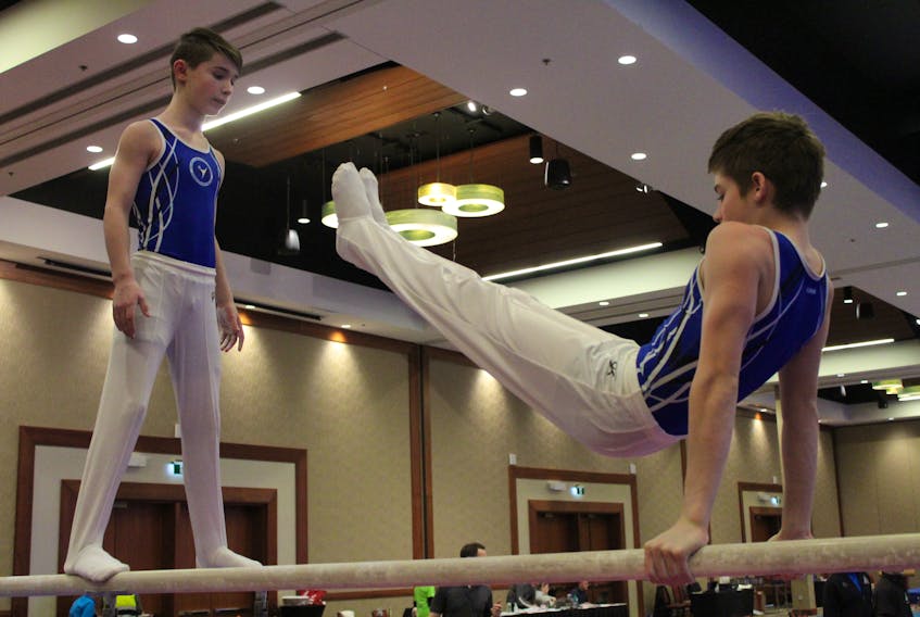 Island gymnasts Oliver Wilson, left, and Ryan Dwyer get some practice in during the Prince Edward Classic at the Delta Hotel in Charlottetown, which took place from Jan. 17 to 19. - Daniel Brown