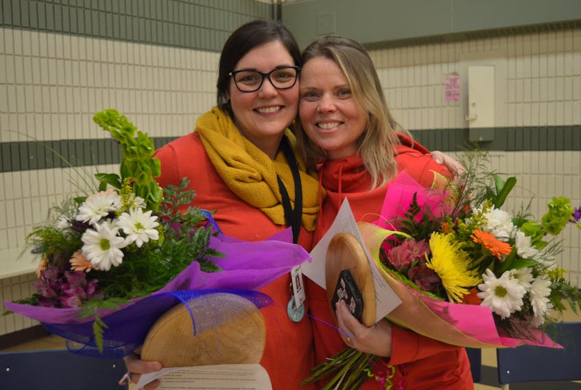 Robyn Burgess, left, and Nena Matheson were caught off guard recently when the P.E.I. Home and School Federation held a ceremony recently at Montague Consolidated School to award the two women with the 2020 Extra Mile Award. Among other things, Burgess and Matheson have teamed up with Sobeys to offer a unique snack program at the school three days per week.
