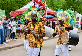 Members of the Rush Bohemian Jonkanoo band march along the Montague waterfront during the DiverseCity Multicultural Festival held in Three Rivers on July 14. The event was part of the larger Montague Summer Days Festival.