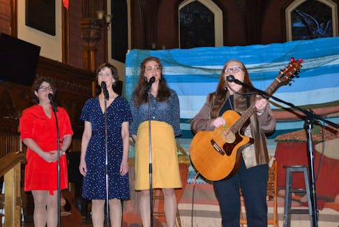The Fascinating Maritime Ladies join Margie Carmichael, right, as she sings her song, In the Wood. Carmichael was guest performer at last week’s opening at St. Paul’s Anglican Church. From left are Kelly Mooney, Catherine O’Brien and Allison Kelly. Produced by Young At Heart Theatre, the shows have been cancelled for the rest of the month due to the coronavirus.