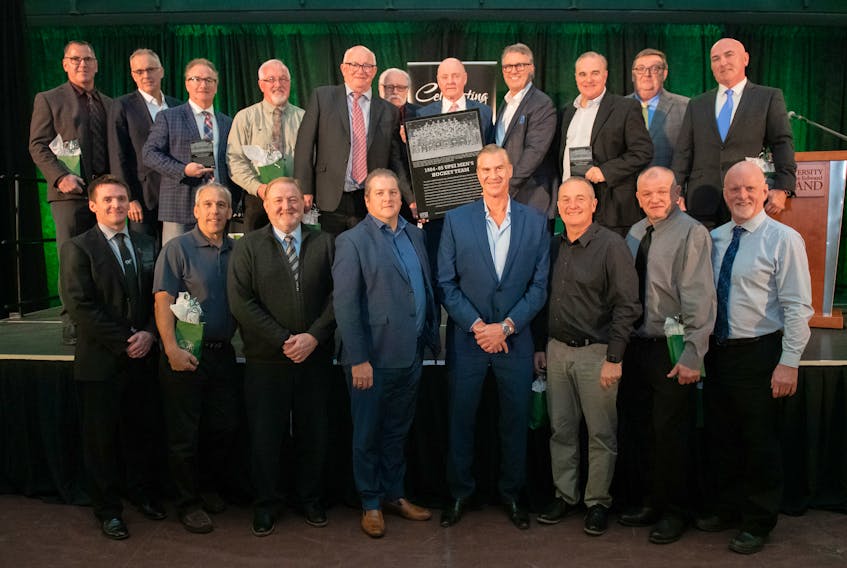 The 1984-85 UPEI Panthers men’s hockey team was inducted into the UPEI Sports Hall of Fame on Thursday. “We were truly a wonderful family,” captain Doug Currie said in thanking the university for the honour on behalf of his team. “You gave us all a tremendous foundation to launch us in our lives and career and we are forever grateful.” Front row, from left, are UPEI director of athletics and recreation Chris Huggan with team members Garth Arsenault, Randy Muttart, John Butler, Darwin McCutcheon, David Reid, Bobby MacDonald and Norman Beck. Second row, Rob Moffat, manager/trainer Kevin MacNeil, Ron Carragher, Gordie Roche, assistant coach Mike Ready, Dennis Clough, who read the team’s citation and is a former UPEI vice-president of finance; head coach Vince Mulligan, captain Doug Currie, Donnie Clow, trainer Paul Peacock and Albert Roche. Missing were Greg Gravel, Steve Fulton, Tony Haliduck, Bob Hicks, John Pocock, Dan Revell, Kevin Skilliter, Jeff Steffan and Todd Sutcliffe.