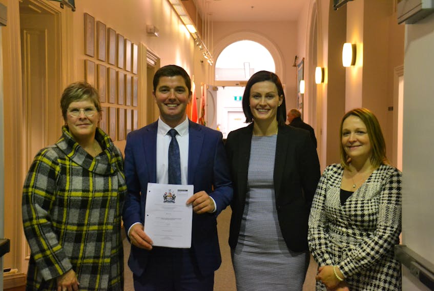 PC MLA Cory Deagle (centre), flanked by Jane Parsons (left), Kelly Cull (middle right) and Jayna Stokes (right) of the Canadian Cancer Society stand outside the P.E.I. legislature. MLA’s unanimously voted to increase the minimum vaping and smoking age to 21.
Stu Neatby/THE GUARDIAN