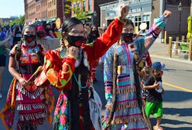 Members of P.E.I.'s Aboriginal community take part in a peaceful march in downtown Charlottetown on Friday.